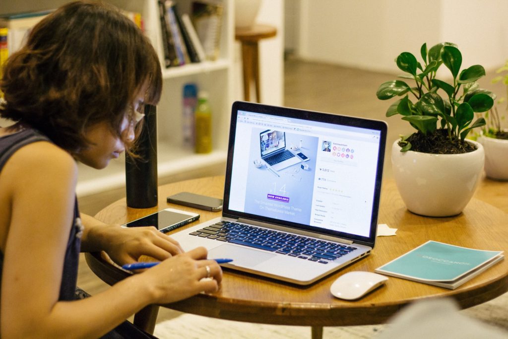 Woman at desk in front of computer